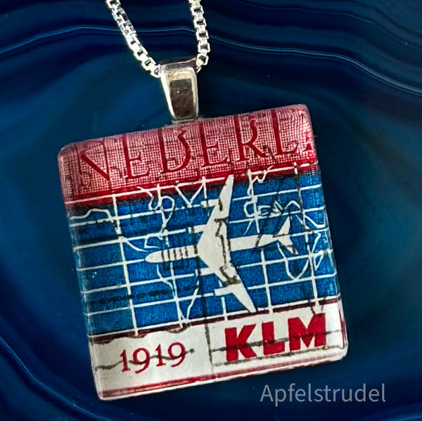 Square glass pendant featuring a genuine 1959 Netherlands postage stamp (Scott #371) celebrating the 40th anniversary of KLM Royal Dutch Airlines, set in a sterling silver frame