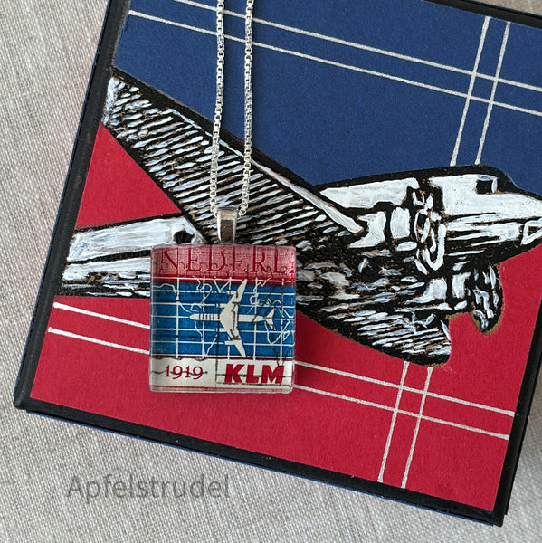 Square glass pendant featuring a genuine 1959 Netherlands postage stamp (Scott #371) celebrating the 40th anniversary of KLM Royal Dutch Airlines, set in a sterling silver frame