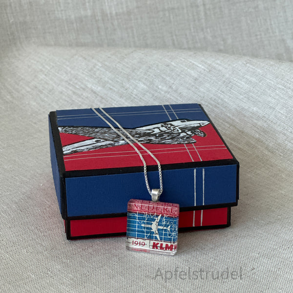 Square glass pendant featuring a genuine 1959 Netherlands postage stamp (Scott #371) celebrating the 40th anniversary of KLM Royal Dutch Airlines, set in a sterling silver frame