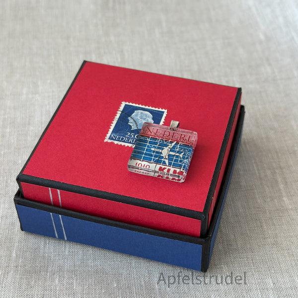 Square glass pendant featuring a genuine 1959 Netherlands postage stamp (Scott #371) celebrating the 40th anniversary of KLM Royal Dutch Airlines, set in a sterling silver frame